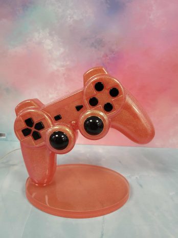 Manette orange lumineuse led en résine époxy.